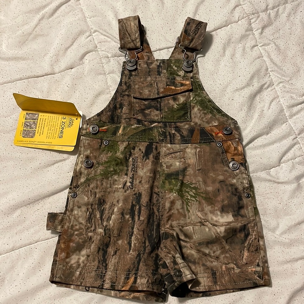 New with tags. Cabelas shorts overalls. Size 6-12 months